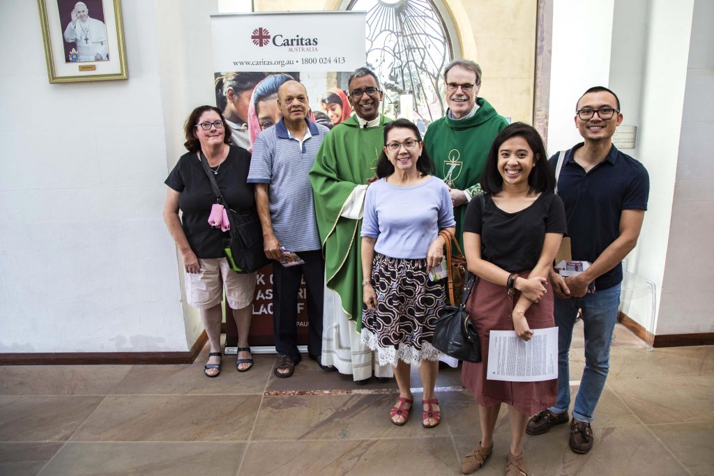St Mary’s Cathedral parishioners pose with Cathedral Dean Fr Sean Fernandez and Caristas Australia Perth Director, Deacon Paul Reid, on the parishes launch of Project Compassion for 2019, Sunday 3 March. Photo: Jamie O’Brien.