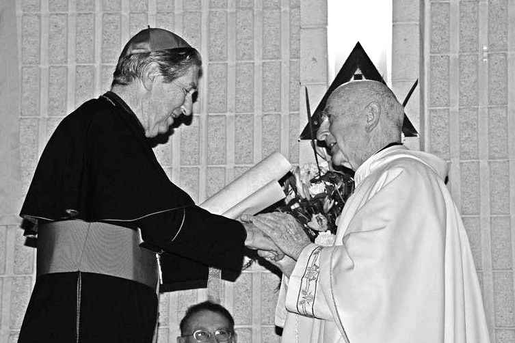 Emeritus Archbishop Hickey presenting Monsignor Peter McCrann with an Apostolic Blessing from the Holy Father. Photo: Sourced.