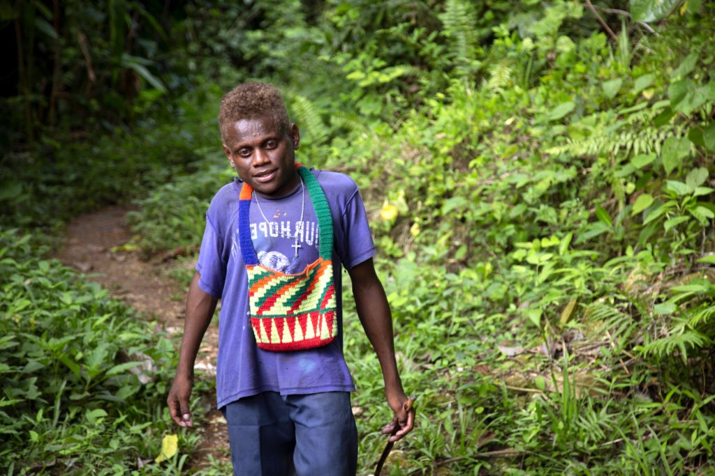 Peter on his long daily walk to find water to drink and bathe in Malaita, Solomon Islands. Photo Cassandra Hill/Caritas Australia.