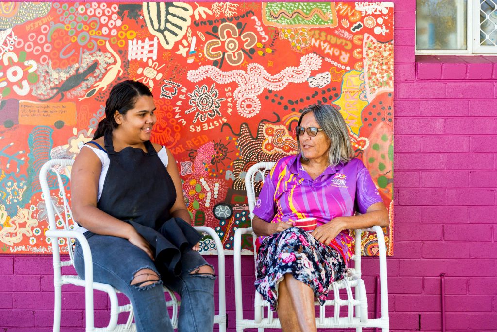 Michaela chats with Purple House colleague Theresa. Photo: Emma Murray/Caritas Australia.