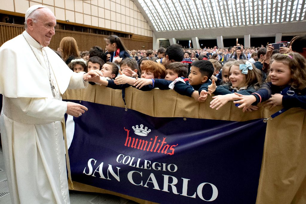 Pope Francis greets students from Milan's Istituto San Carlo during an audience at the Vatican on 6 April 2019. Photo: Vatican Media/CNS.