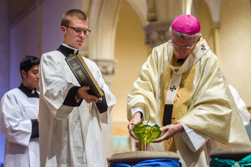 Archbishop Timothy Costello SDB, blessing the three Holy Oils in 2018. Photo: Josh Low. 