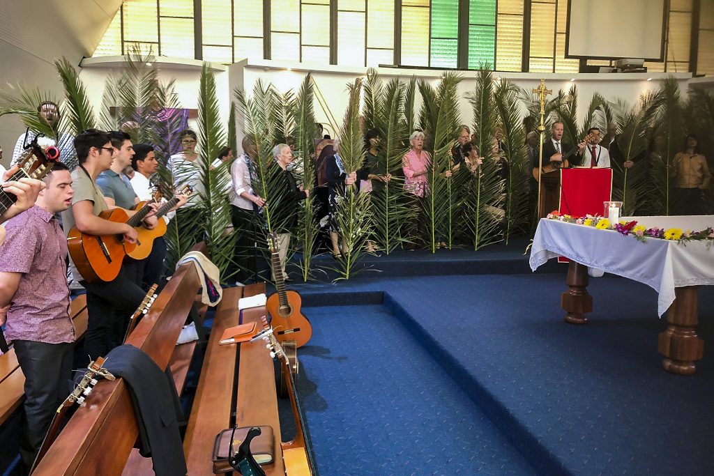 Members of the Neocatechumenal Way sing the Creed during a Eucharist for Palm Sunday, 14 April, at Mirrabooka Parish. Photo: Luke Wyatt.