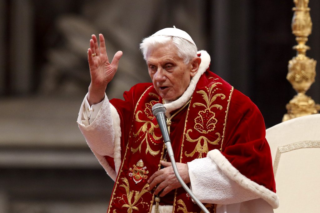 Pope Benedict XVI delivers a blessing at the conclusion of a Mass for the Knights of Malta in St Peter's Basilica at the Vatican on 9 February 2013, two days before he announced his resignation. The retired pope marked his 92nd birthday on 16 April. Photo: Paul Haring/CNS.