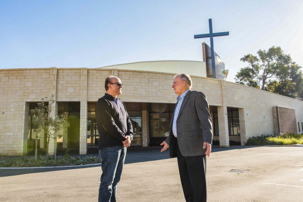 Project Manager John Abrusci (left) chats with Leadership Gifts Chairman Alex Banovich. The new St Joseph Pignatelli Church has a visible presence on Galloway St. Photo: Matthew Lau.