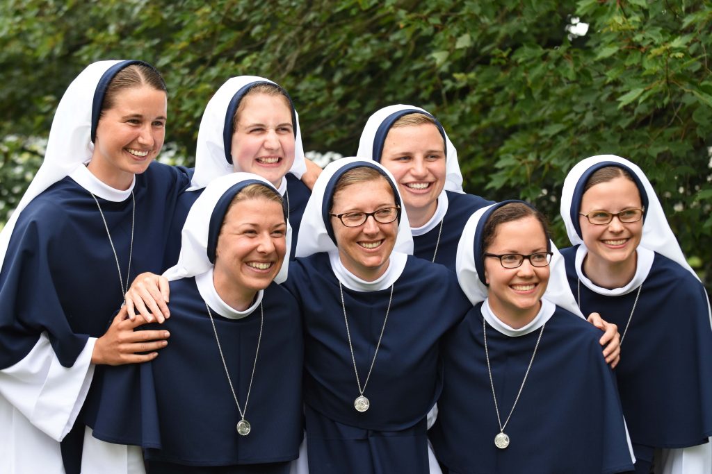 Seven young women who made their First Profession as Sisters of Life in August 2018, including Sister Mary Grace (far left) who was born and raised in Sydney. Photo: Sourced.