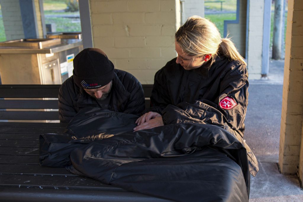 The Order of Malta has initiated a project to provide some comfort to those sleeping rough, by distributing their specially designed “Coats for the Homeless”. Photo: Supplied.