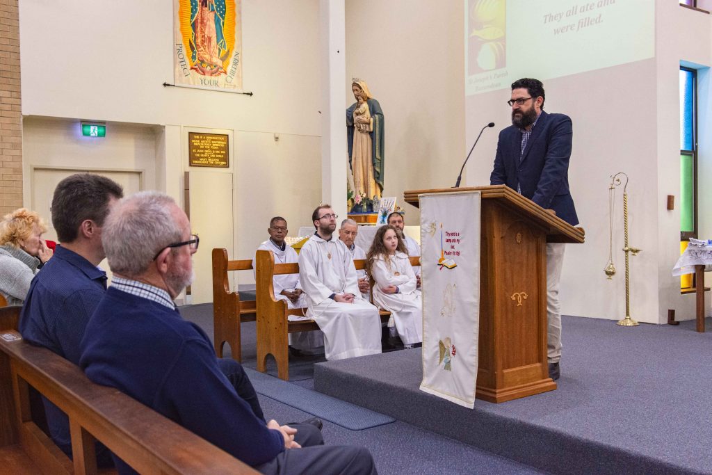Parish council member, Nathan Jarvis, presented an overview of the bell’s history, a copy of which was distributed with the weekly announcements for posterity. Photo: Eric Martin