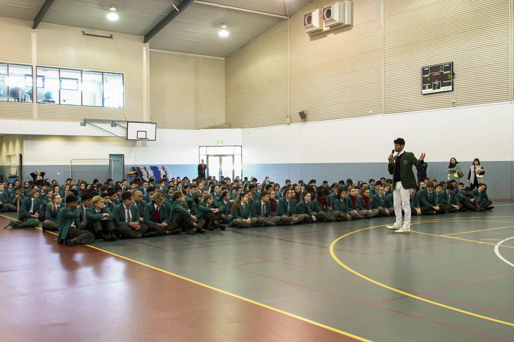 Chisholm College student Alex Myint speaks to fellow students, having professionally competed in last year’s Youth Olympic Games in the sport of Roller Speed Skating. Photo: Supplied.