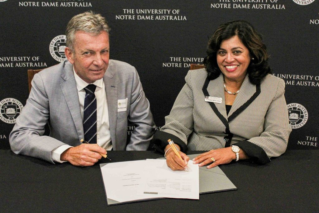 Fremantle Ports Chief Executive Chris Leatt-Hayter and UNDA Head of Fremantle Campus Prof Selma Alliex sign the MOU on Thursday 16 May. Photo: Supplied.