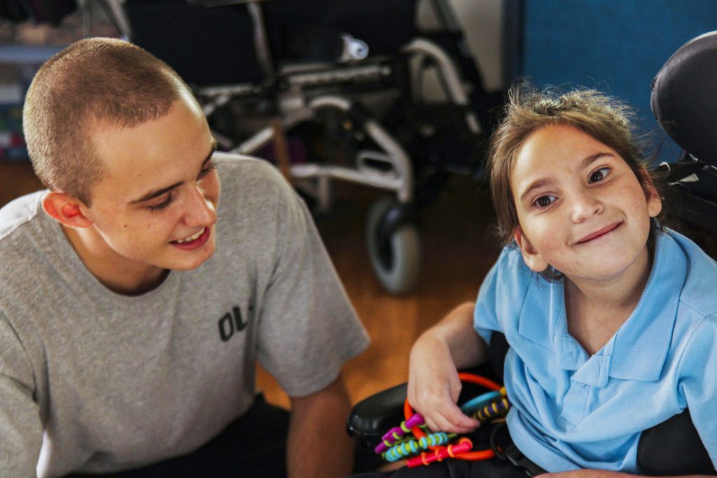 Identitywa support worker pictured with Olivia at the Riverton Children’s House. Photo: Supplied.