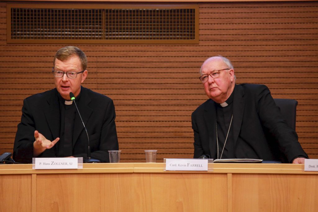 Jesuit Father Hans Zollner, president of the Centre for Child Protection at the Pontifical Gregorian University in Rome, and Cardinal Kevin J. Farrell, prefect of the Vatican's Dicastery for Laity, the Family and Life, participate in a meeting sponsored by the dicastery in Rome. Photo: Dicastery for Laity, Family and Life/CNS.