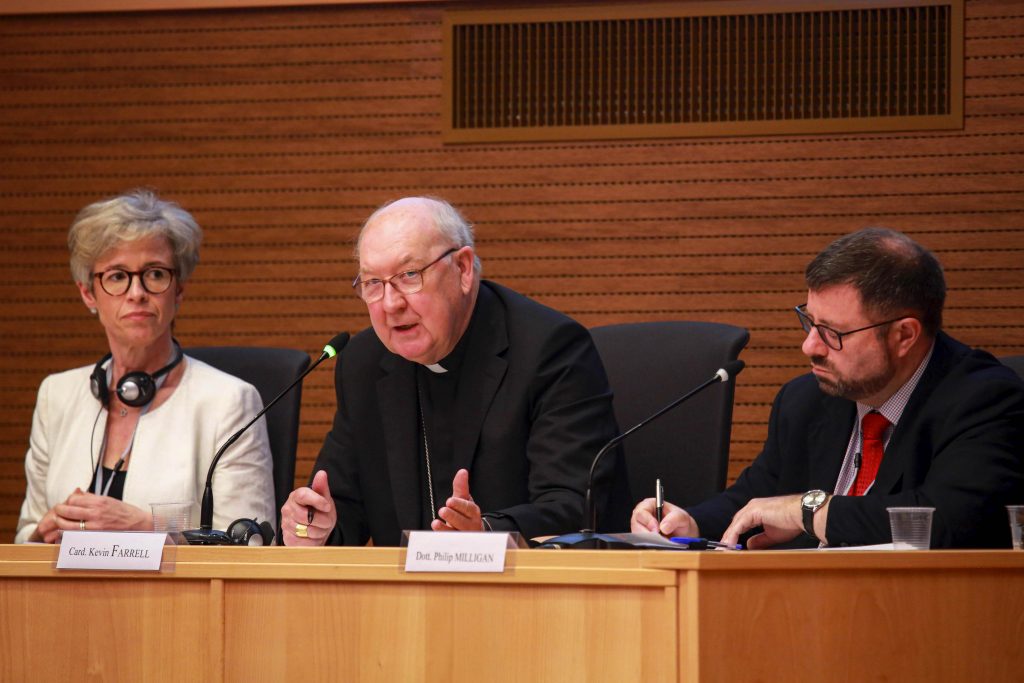Cardinal Kevin J Farrell speaks during a meeting sponsored by the Vatican's Dicastery for Laity, Family and Life in Rome on 13 June 2019. At left is Linda Ghisoni, a canon lawyer who serves as a consultant for the Congregation for the Doctrine of the Faith; at right is canon lawyer Philip Milligan. Photo: Dicastery for Laity, Family and Life/CNS.