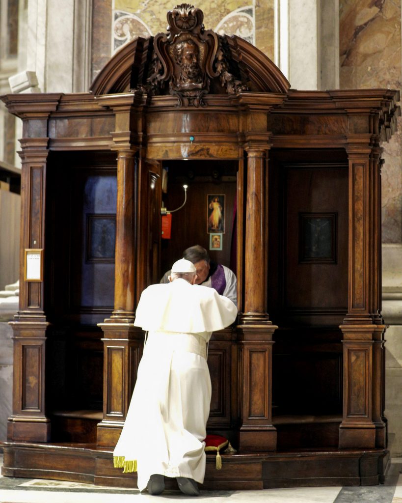 A priest hears Pope Francis' confession during a Lenten penance service in St Peter's Basilica at the Vatican on March 29, 2019. In the light of "a worrying negative prejudice" against the Catholic Church, Pope Francis ordered the publication of a document affirming the absolute secrecy of everything said in confession and calling on priests to defend it at all costs, even at the cost of their lives. Photo: CNS/Andrew Medichini.