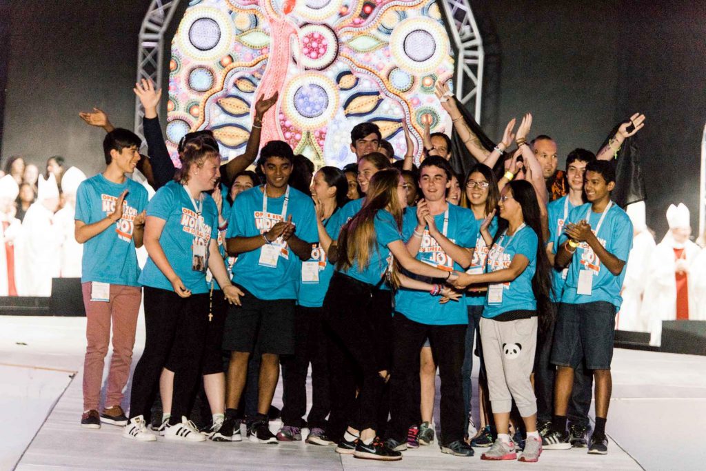 Young people celebrate on stage at the 2017 ACYF following the announcement that the next ACYF will be in held in Perth, from December 8 to 10. Photo: Cyron Sobrevinas.