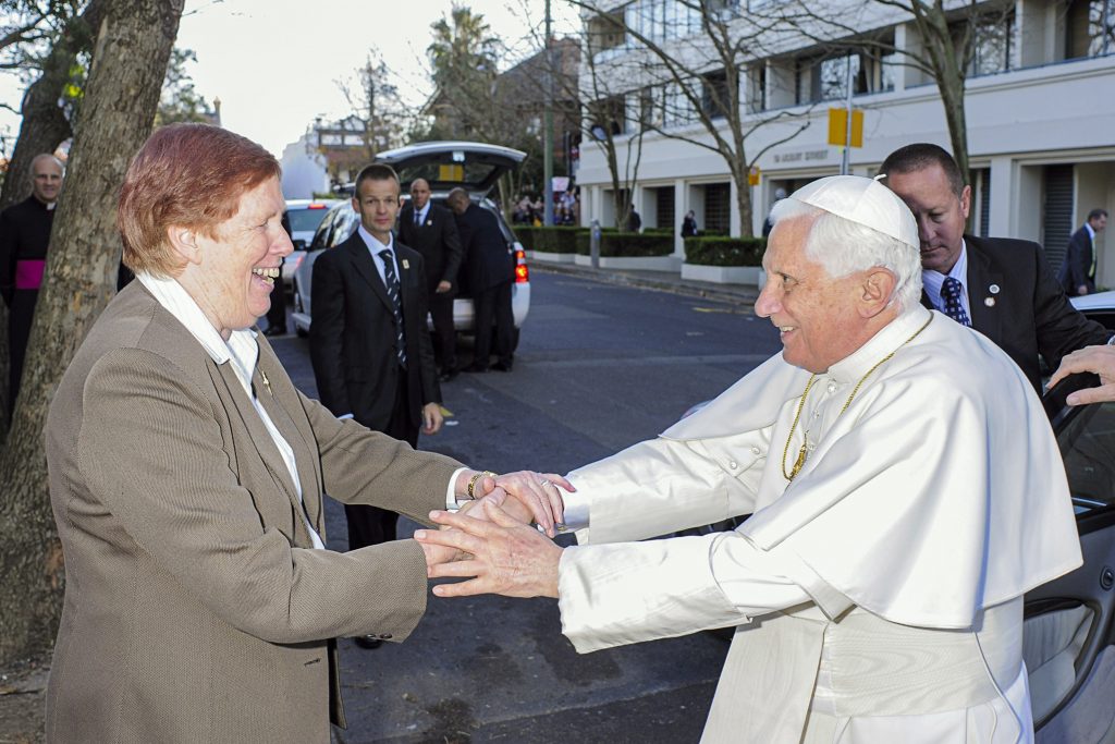 Sr Anne Derwin RSJ greets Pope Benedict XVI as he arrives at the chapel in North Sydney that houses St Mary MacKillop’s tomb Photo: Sourced.