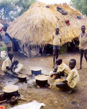 Philip Lako (far left) together with friends from Palotaka in Omere Camp, Acholiland in 1994, four years after leaving the village. Photo: Pende Ng’oong.