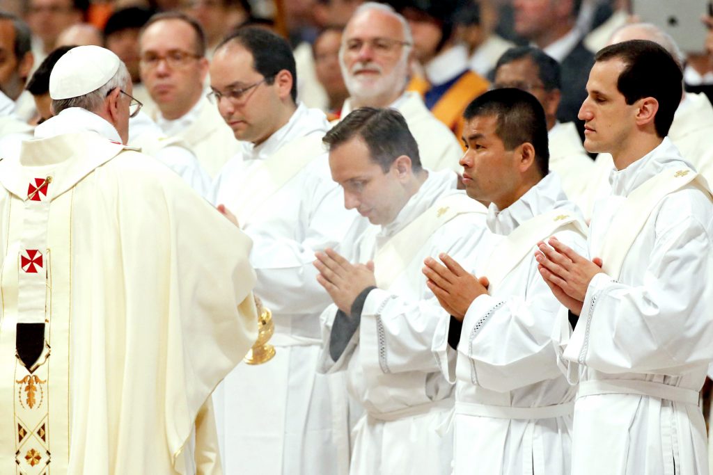 Pope Francis uses incense to bless new priests before their ordination Mass in St Peter's Basilica at the Vatican on 11 May 2014. Photo: Stefano Rellandini/Reuters.