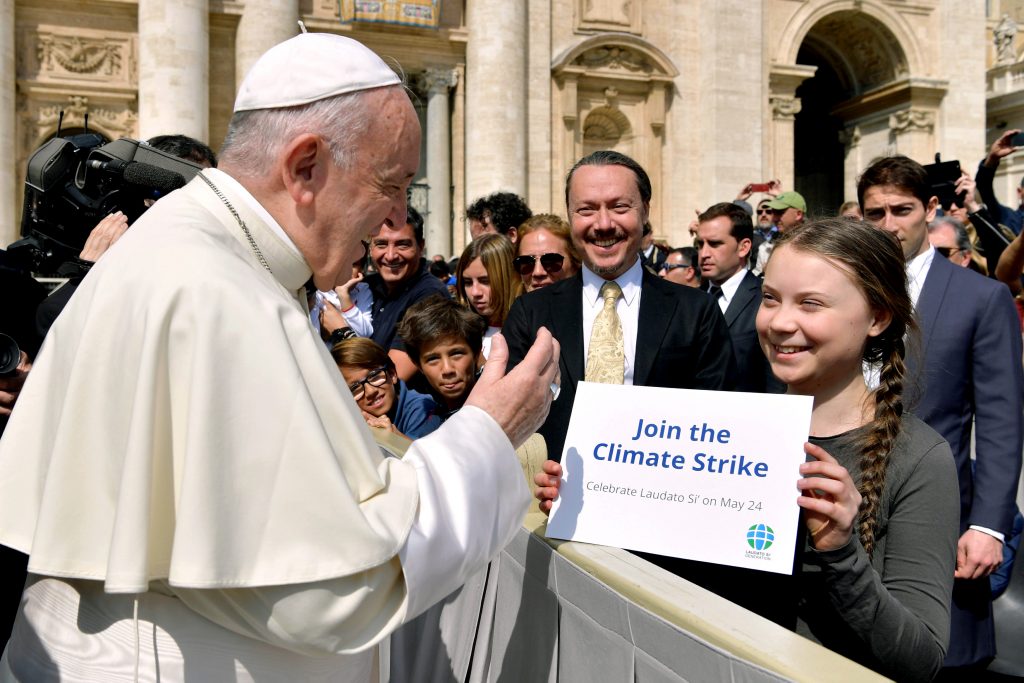 Pope Francis greets Swedish climate activist Greta Thunberg during his general audience in St Peter's Square at the Vatican on 17 April 2019. In a new interview on the upcoming Synod of Bishops on the Amazon, Pope Francis praised the increased awareness and efforts among young people to seek action on climate change. Photo: Yara Nardi/Reuters.