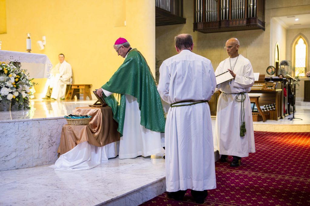 Archbishop Timothy Costelloe SDB blesses the plaque commemorating St Patrick’s 25th anniversary as an ecclesiastical basilica. Photo: Eric Martin.