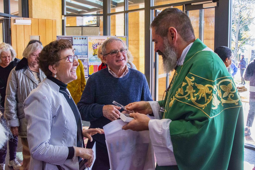 Parishioners of St Benedict’s Church in Applecross greet the recently ordained Fr Mark Rucci on 18 August. Photo: Matthew Lau.