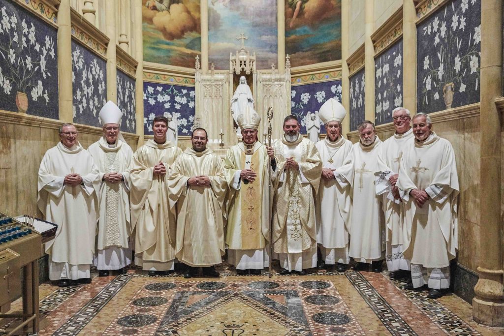 Fathers Liam Ryan, Mark Rucci, and Matteo Verdi were Ordained to the Priesthood on Friday 16 August at the St Mary’s Cathedral. Here they stand with Archbishop Timothy Costelloe SDB, Auxiliary Bishop Donald Sproxton and Archdiocesan Priests. Photo: Ron Tan.