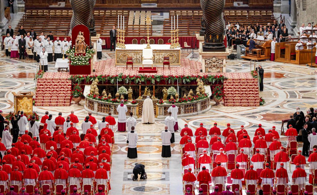 Pope Francis prays as he arrives for a consistory to create new cardinals in St. Peter's Basilica at the Vatican in this 28 June 2017 file photo. The Holy Father announced on 1 September that he would create 13 new cardinals at a 5 October consistory. Photo: Paul Haring/CNS.