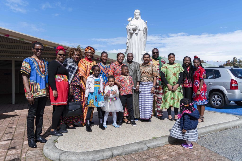 Lockridge Priest Father Timothy Tapoona stands with some parishioners during the 25th anniversary celebrations of the Good Shepherd Church on 3 September. Photo: Feby Plando.