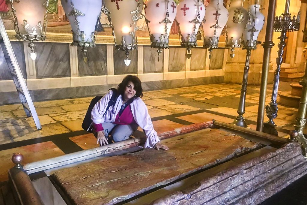 BJ Hickey Scholarships 2019 winner, Rita de Faria, recently attended the Easter Encounter Program at the Tantur Ecumenical Institute in Jerusalem from 11 April to 2 May 2019. Here, she is pictured touching the stone of Unction or Anointing of the body of Jesus, inside Church of the Holy Sepulchre, Jerusalem. Photo: Supplied.
