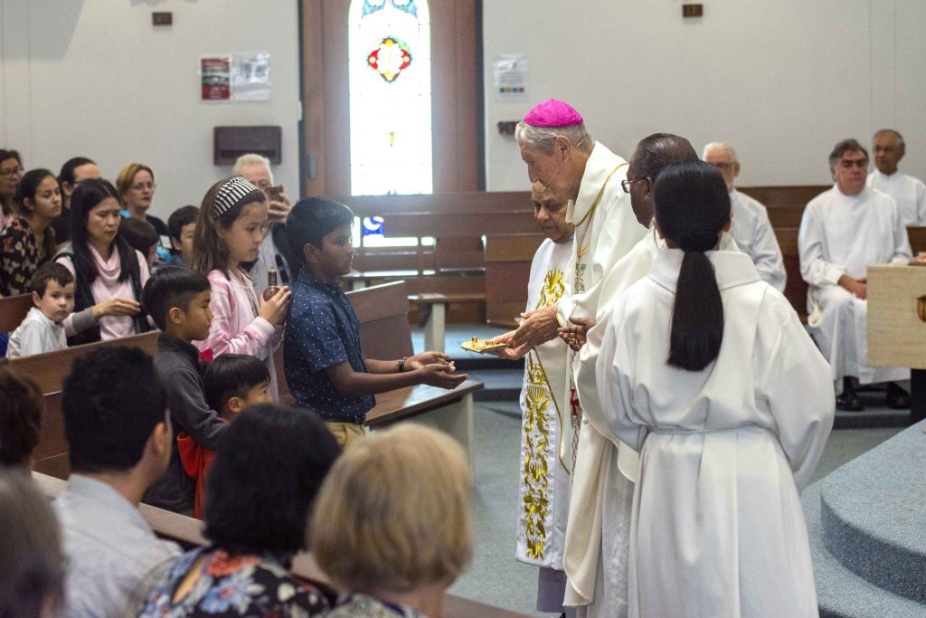 The St Francis of Assisi Children’s Liturgy and Catechist Groups bring the Offertory to the sanctuary. Photo: Matthew Lau.